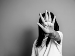 Woman saying stop with hand up