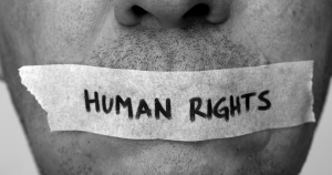 human rights taped over man's mouth