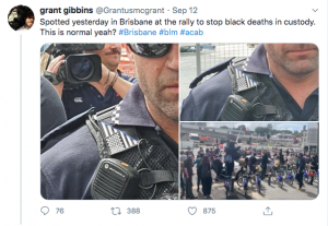 Queensland Police Officer with patch depicting a US flag bisected diagonally with a thin blue line