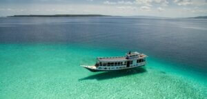 A boat in the waters off the village of Bau Bau in South East Sulawesi, Indonesia