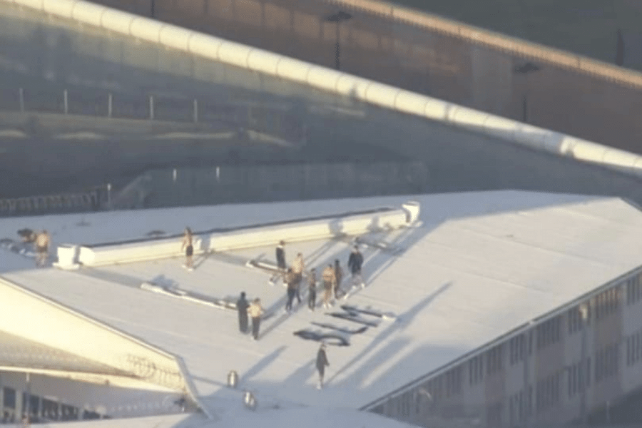 Protesters at Parklea Correctional Centre spelt out "BLM" with their bed sheets.