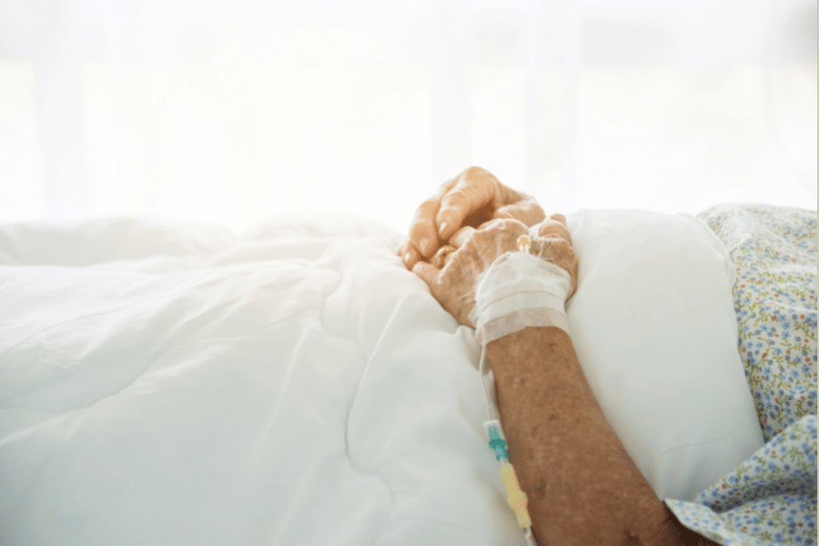 person lying in hospital seeking voluntary euthanasia