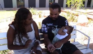 Terrance Flowers with his partner and young baby