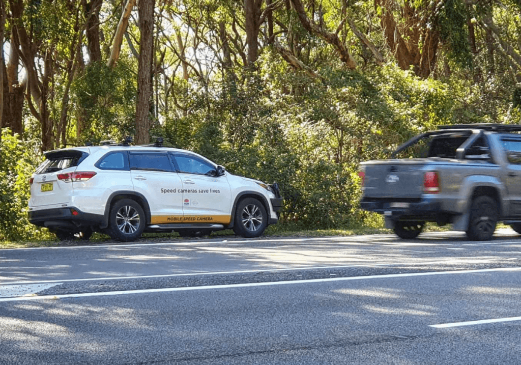 Mobile speed camera signs warn of upcoming cameras