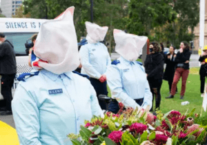 protest advocating we ban spit hoods