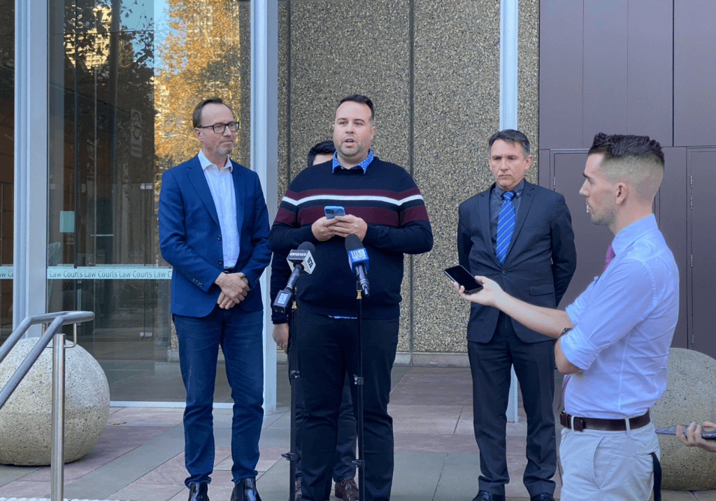 Shane Bazzi a a press conference today in front of the Federal Court (L to R: David Shoebridge, Shane Bazzi, Stewart O'Connell)