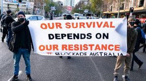 Protestors holding sign 