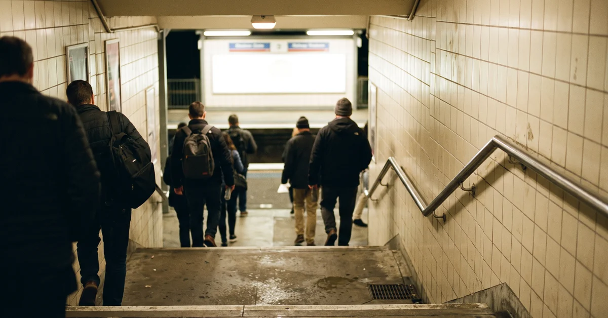 Tiled station underpass stairway at night
