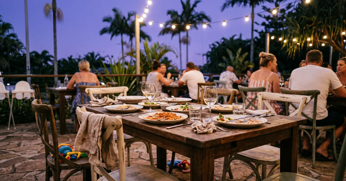 Outdoor restaurant table on a Gold Coast terrace at dusk