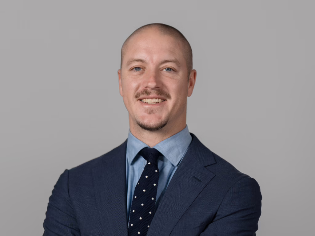 A portrait of a man wearing a suit and tie