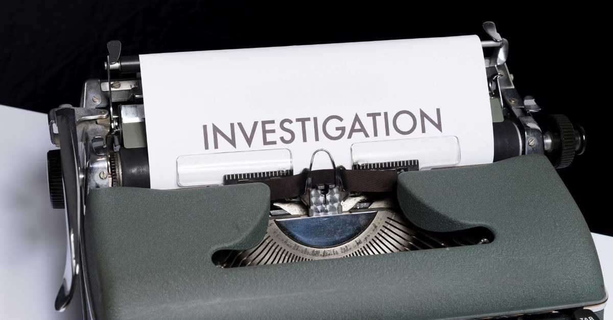 NSW Police Misconduct | O'BRIEN CRIMINAL & CIVIL SOLICITORS a typewriter with a page in it saying investigation