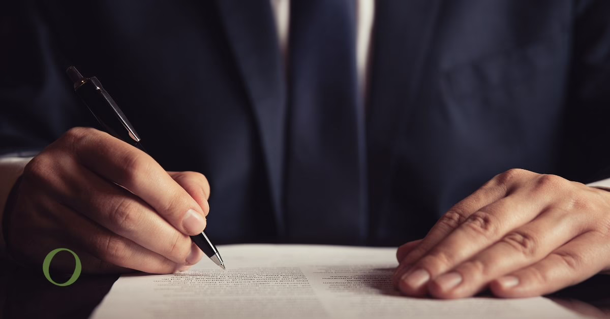A man signing a document
