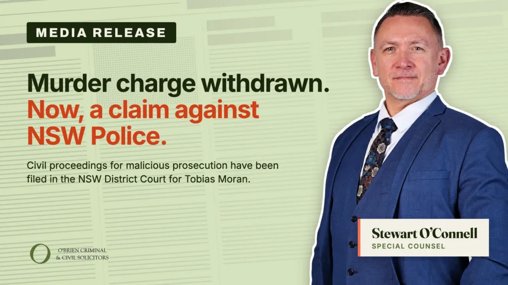 Media release banner: 'Murder charge withdrawn. Now, a claim against NSW Police.' A man in a blue suit stands on the right with law firm branding bottom left.
